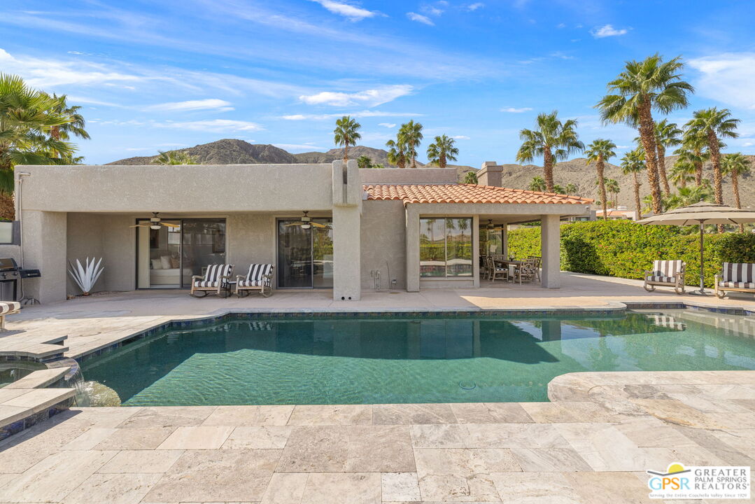 8 Alta Vista Rancho Mirage, CA 92270 - Photo 5 of 46 a view of a house with a swimming pool and a chairs