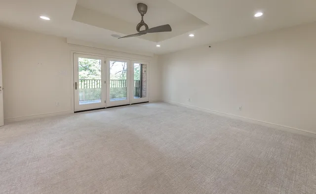 a spacious bathroom with a bathtub and sink