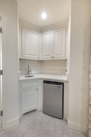 a large bathroom with a large tub sink and window