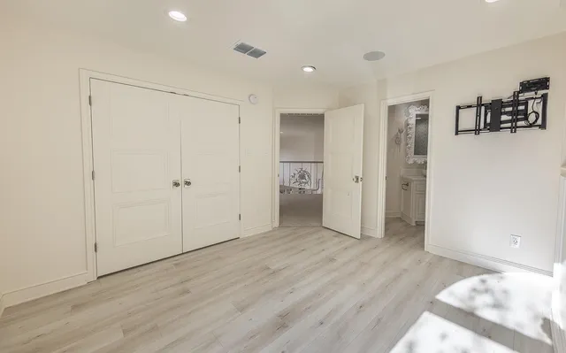 a balcony with furniture and large windows