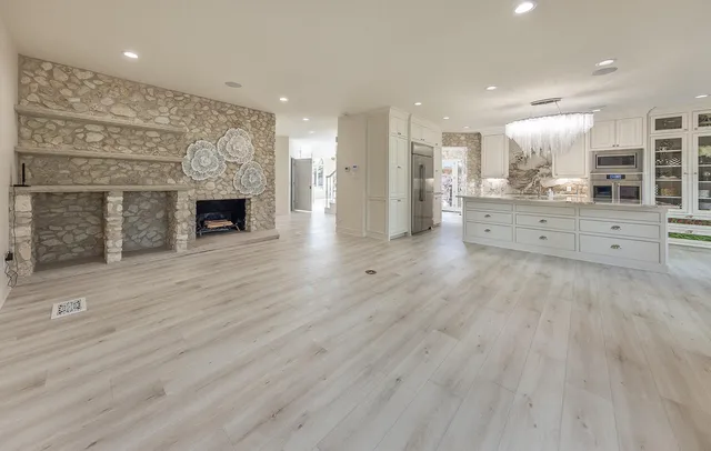 a view of kitchen with cabinets and outdoor space