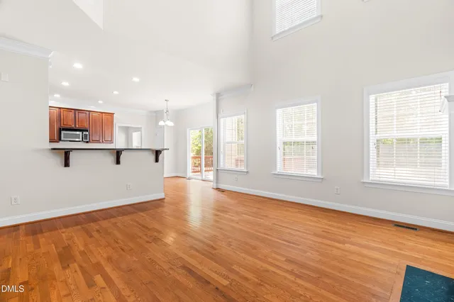 a view of kitchen with wooden floor and window