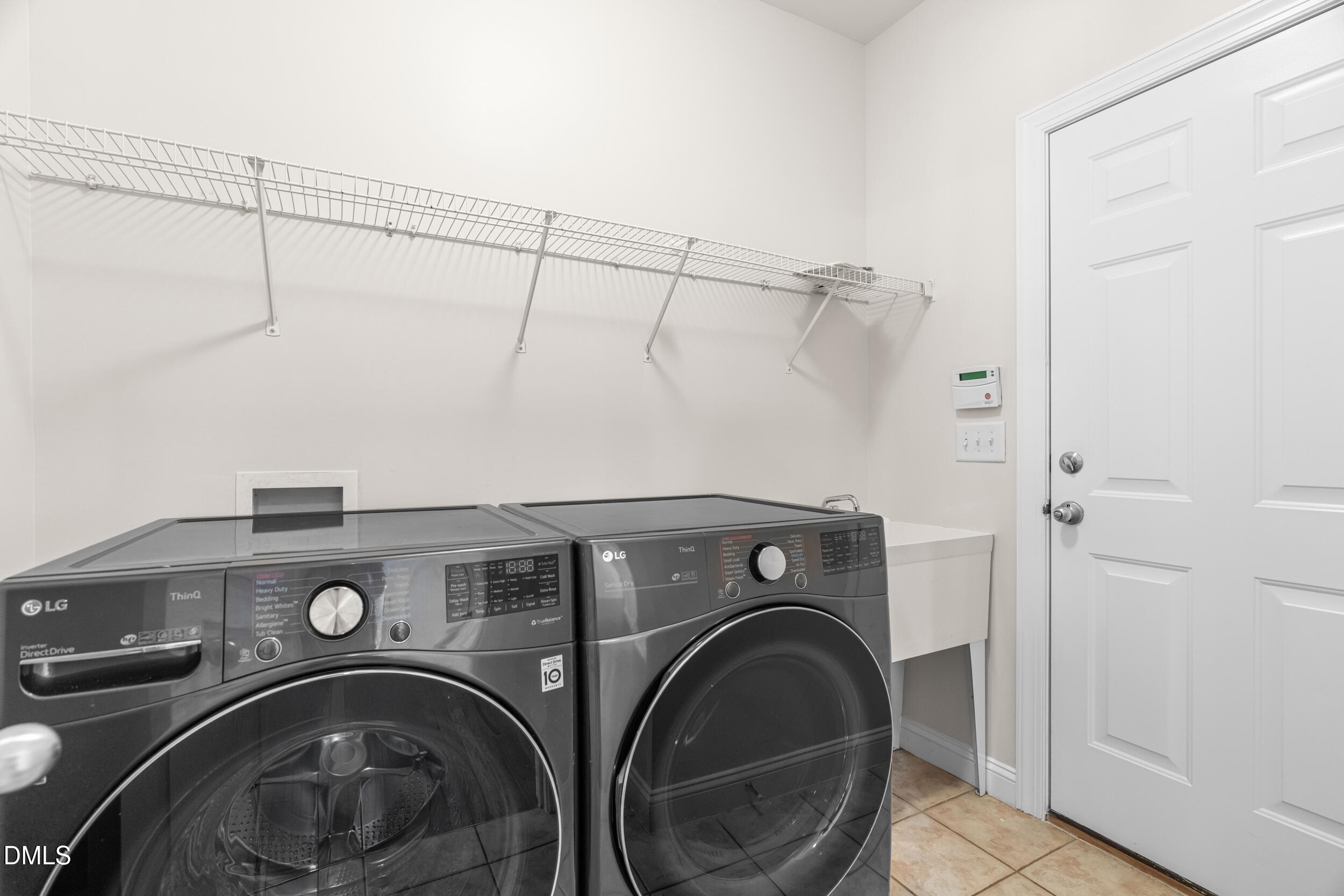 5708 Catskill Court Durham, NC 27713 - Photo 18 of 39 a utility room with dryer and washer