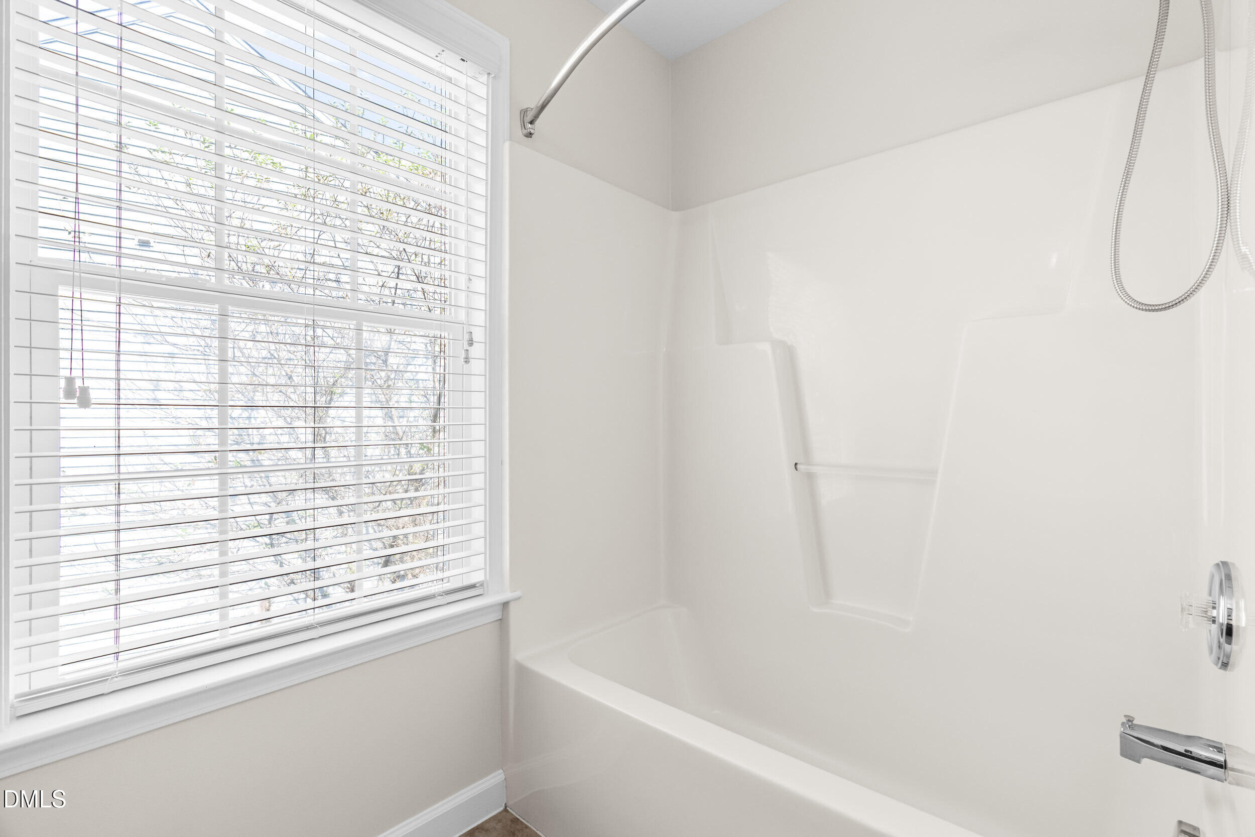 5708 Catskill Court Durham, NC 27713 - Photo 24 of 39 a bathroom with a bathtub and shower