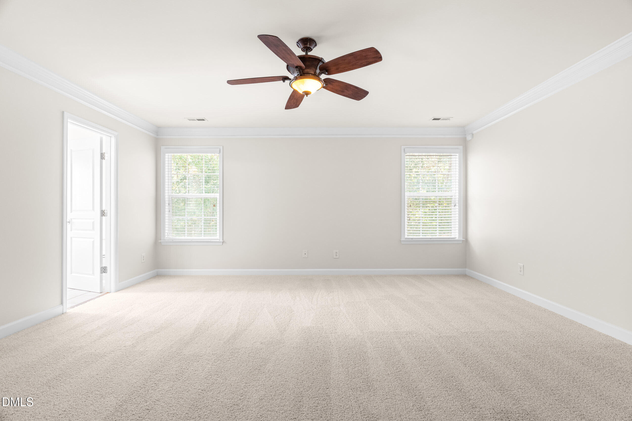 5708 Catskill Court Durham, NC 27713 - Photo 25 of 39 an empty room with ceiling fan and windows