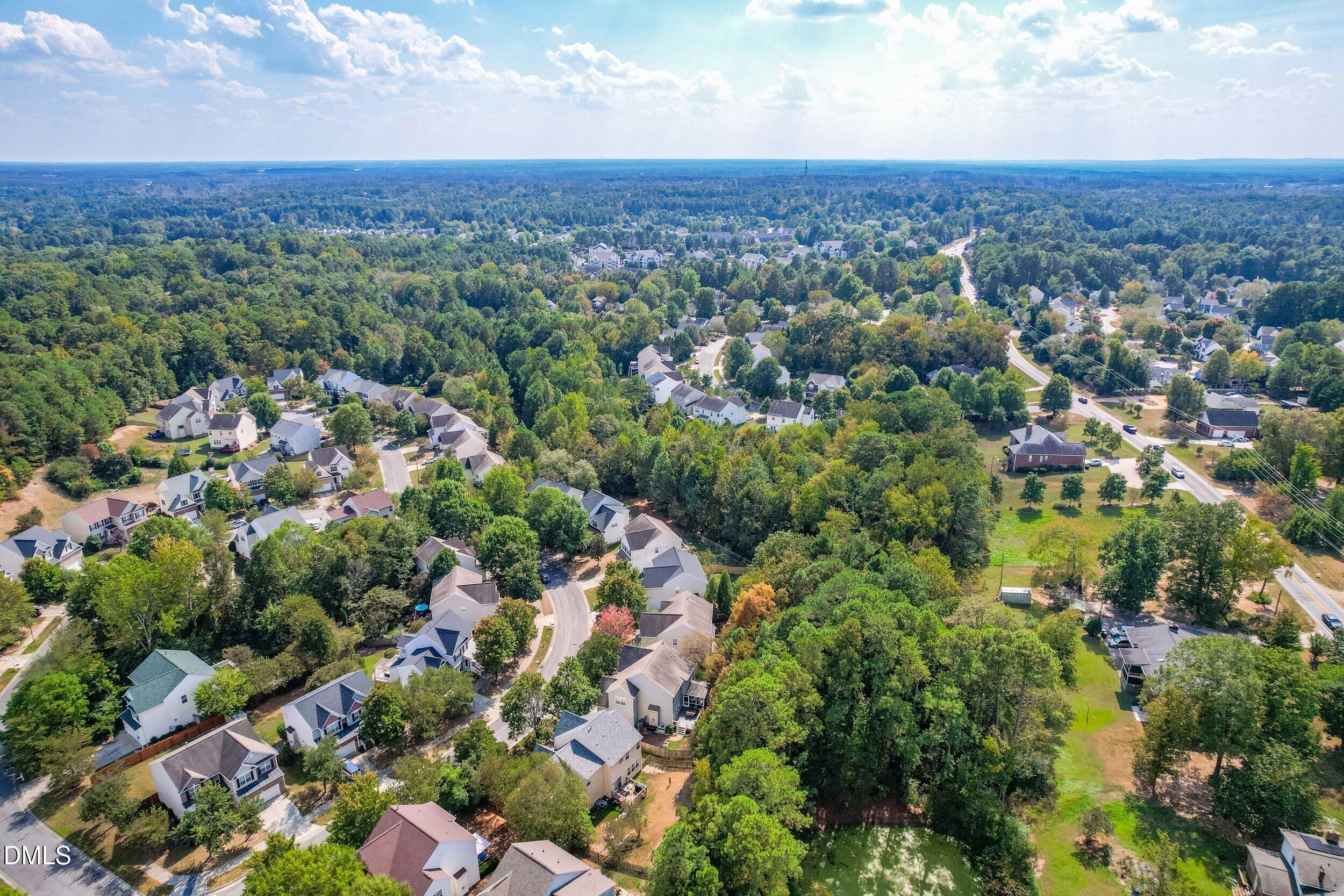 5708 Catskill Court Durham, NC 27713 - Photo 39 of 39 an aerial view of a houses with a yard and green space