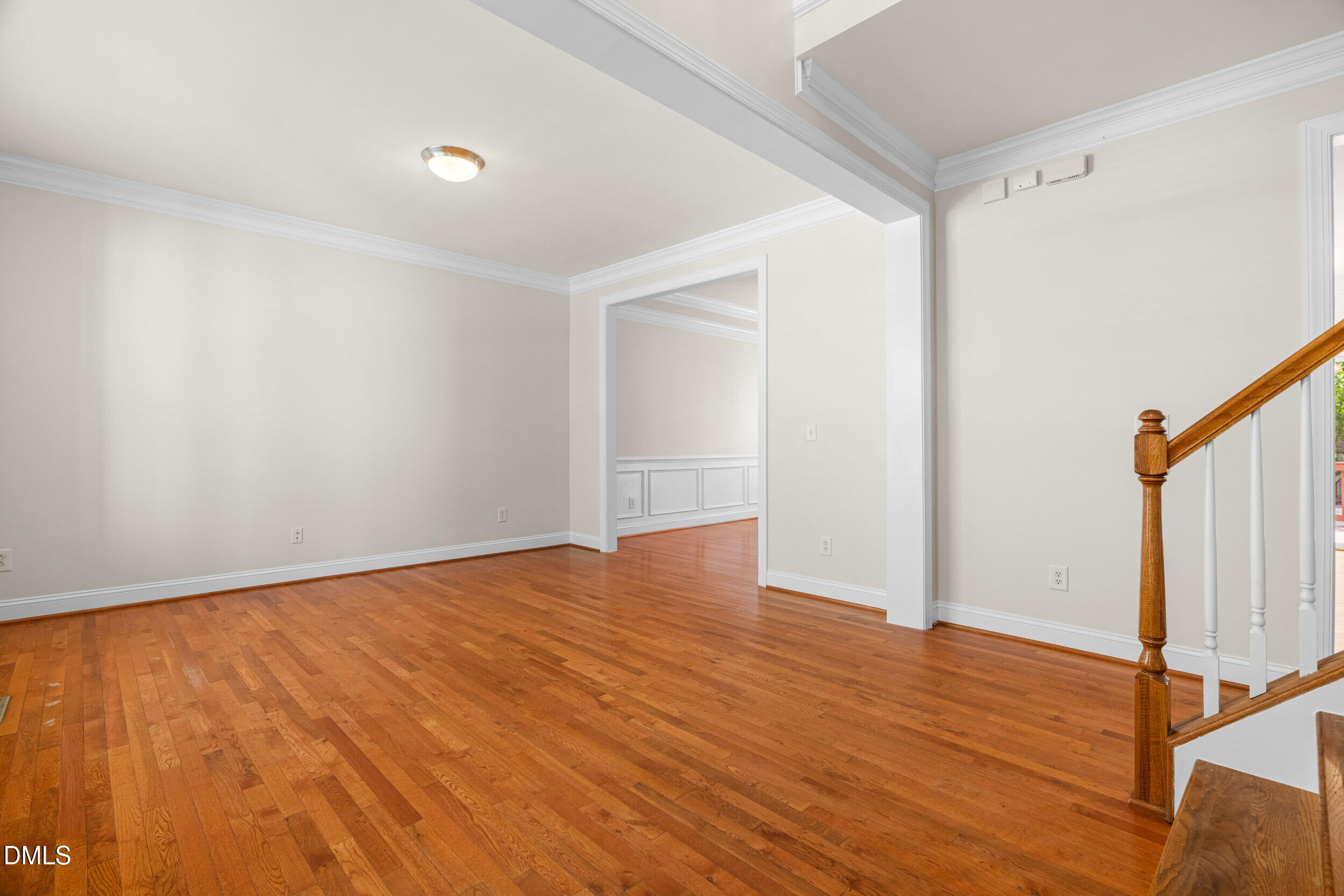 5708 Catskill Court Durham, NC 27713 - Photo 4 of 39 a view of an empty room with wooden floor