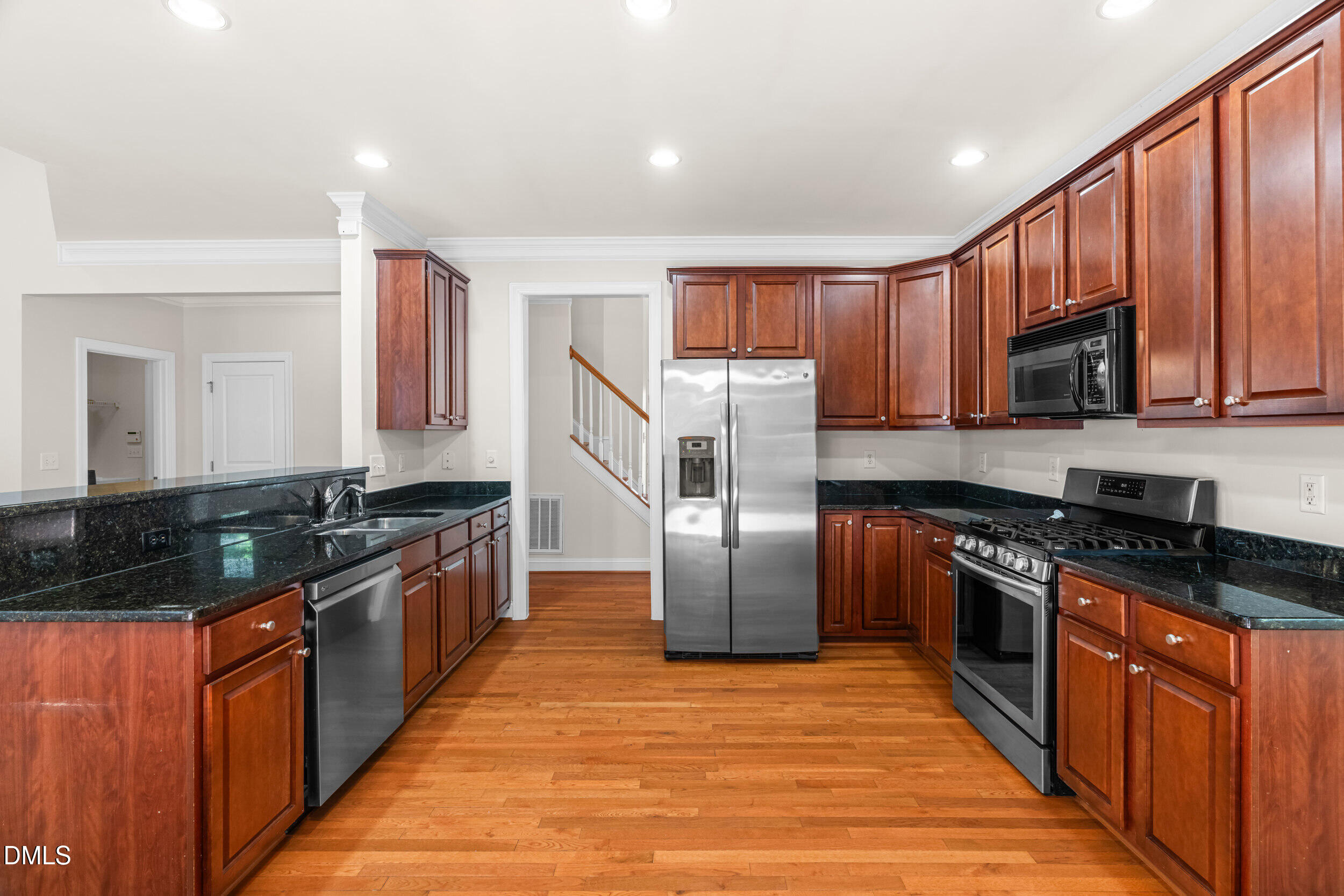 5708 Catskill Court Durham, NC 27713 - Photo 10 of 39 a kitchen with stainless steel appliances granite countertop a stove a sink dishwasher a refrigerator and a oven