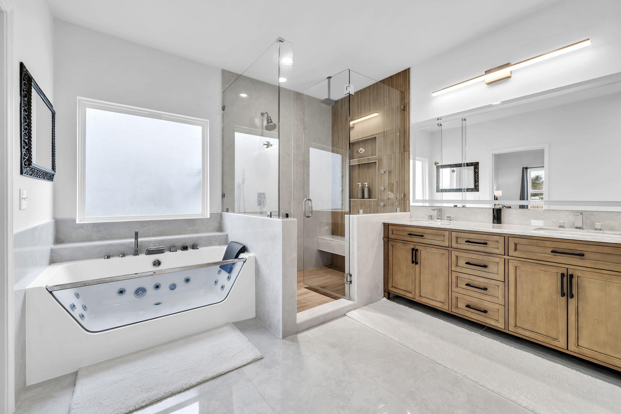 106 Mary Ellen Way Freeport, FL 32439 - Photo 26 of 79 a spacious bathroom with a double vanity sink tub and mirror