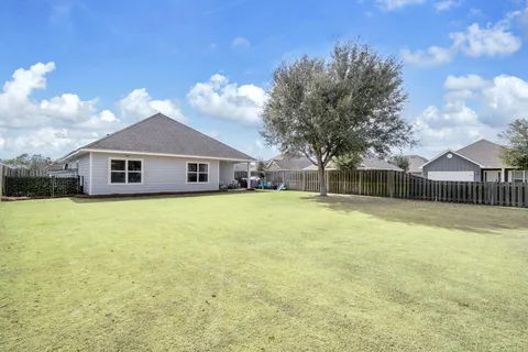 aerial view of residential houses with outdoor space and swimming pool