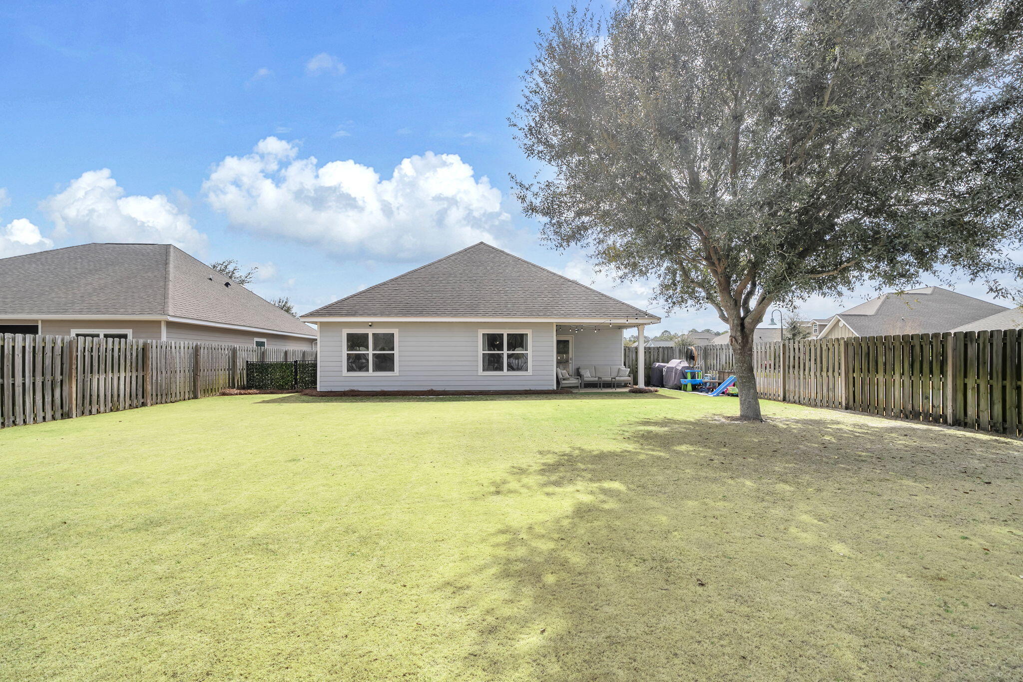 106 Mary Ellen Way Freeport, FL 32439 - Photo 44 of 79 a front view of house with yard and trees in the background