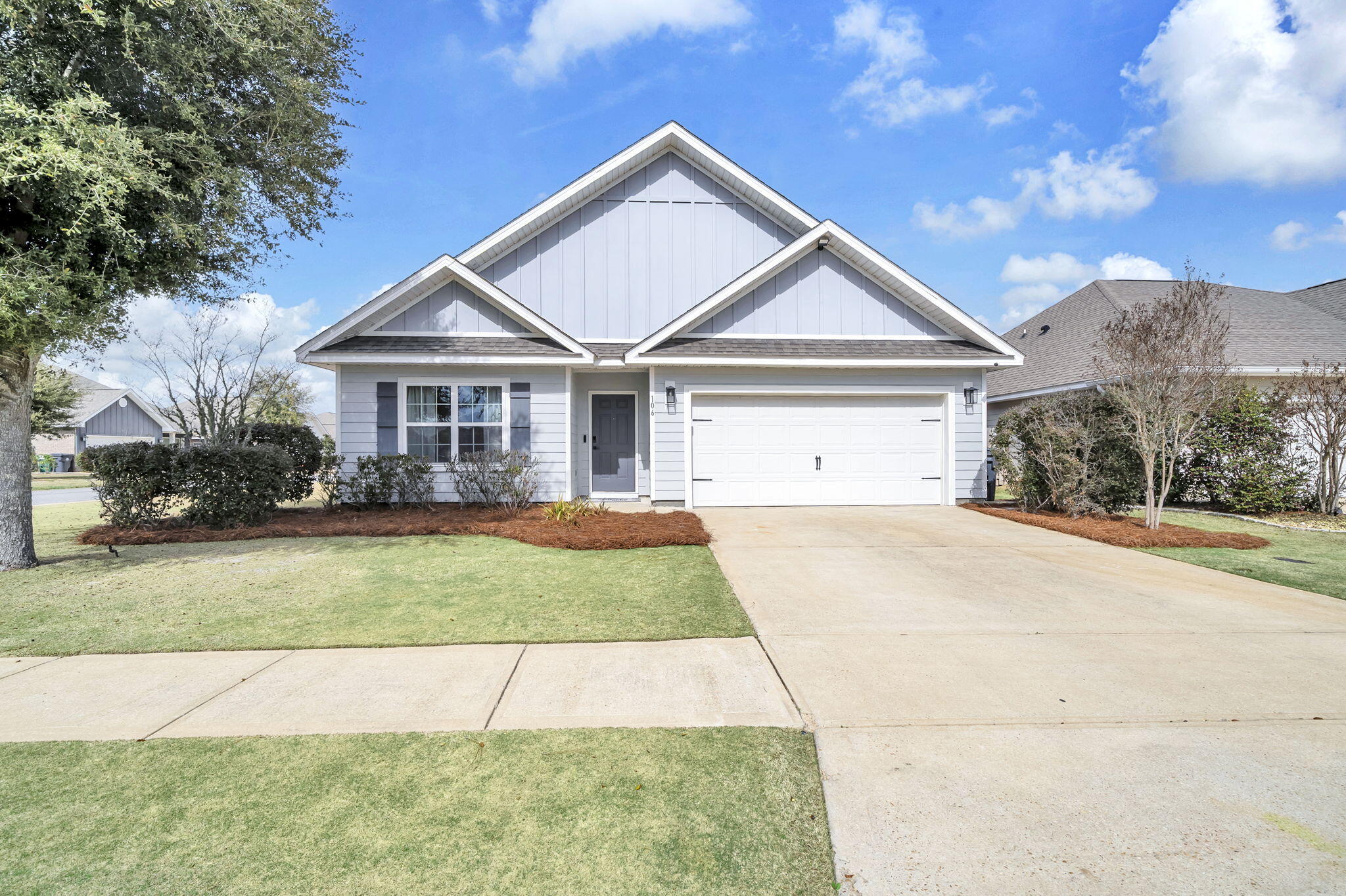 106 Mary Ellen Way Freeport, FL 32439 - Photo 52 of 79 a front view of a house with a yard and garage