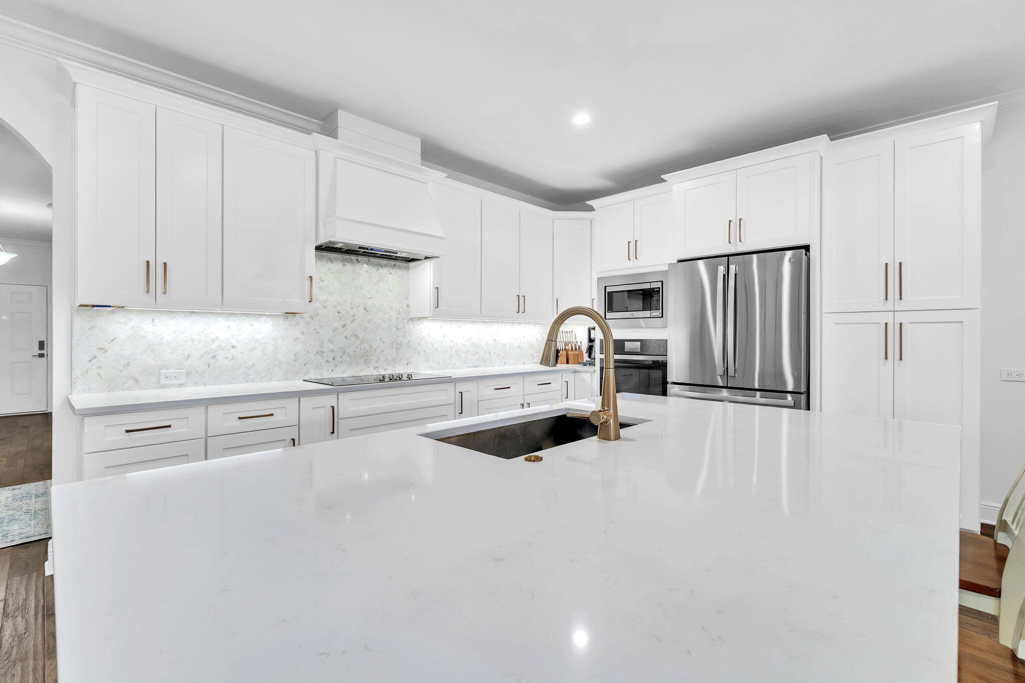 106 Mary Ellen Way Freeport, FL 32439 - Photo 9 of 79 a kitchen with stainless steel appliances granite countertop a refrigerator sink and white cabinets