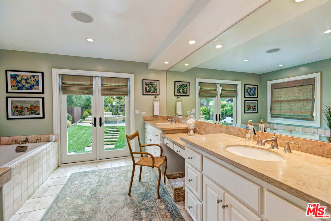20779 Big Rock Drive Malibu, CA 90265 - Photo 18 of 37 a dining hall with stainless steel appliances granite countertop a sink and a large window