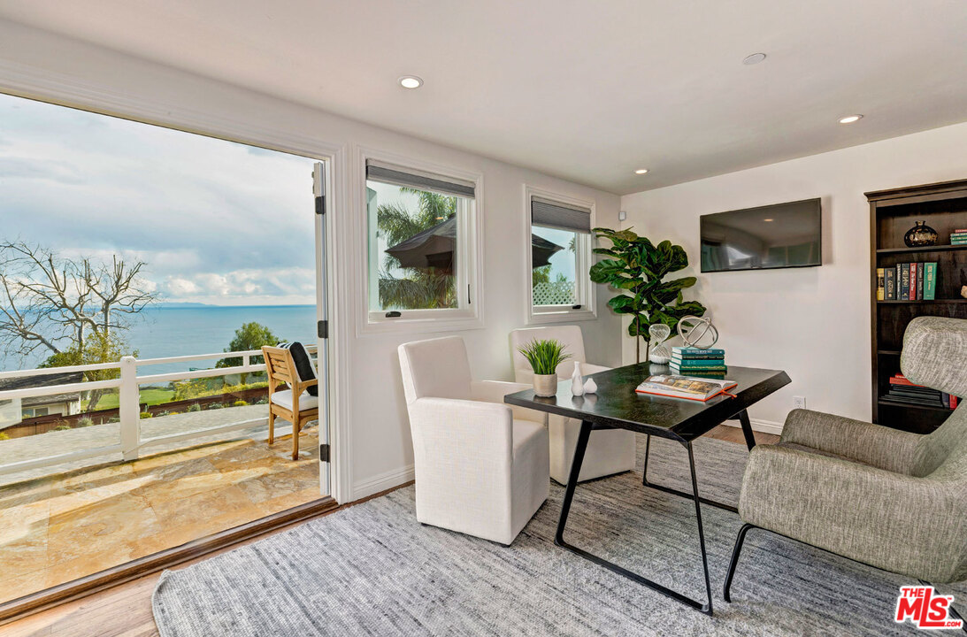 20779 Big Rock Drive Malibu, CA 90265 - Photo 27 of 37 a workspace with furniture window and wooden floor