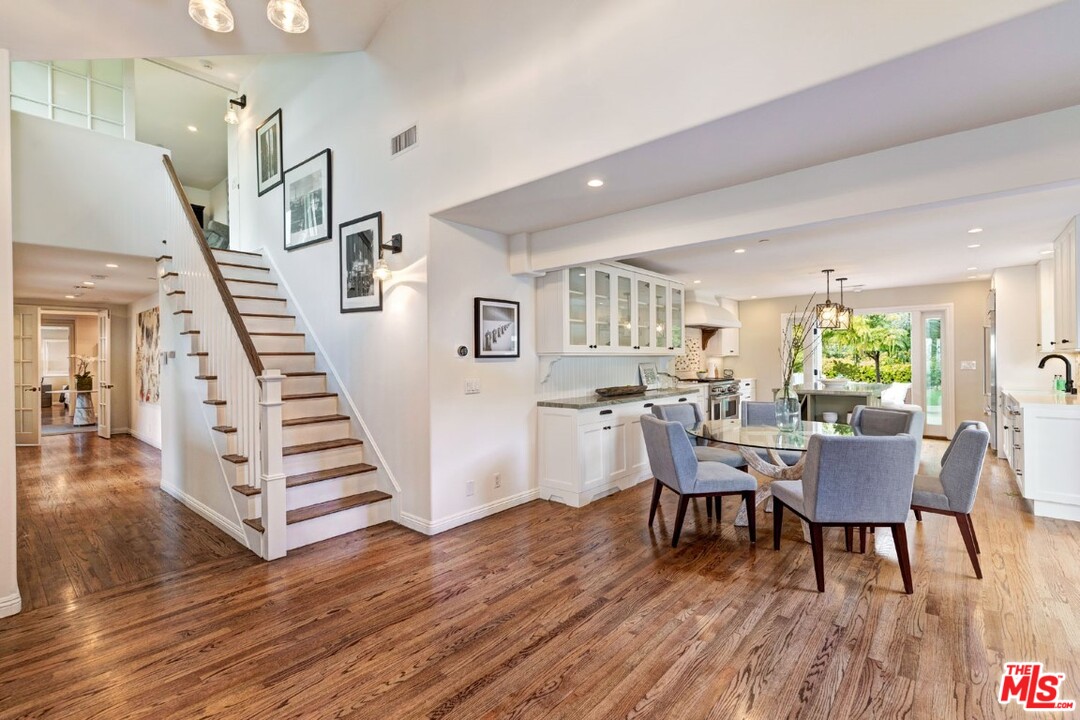 20779 Big Rock Drive Malibu, CA 90265 - Photo 10 of 37 a view of a dining room with furniture and wooden floor