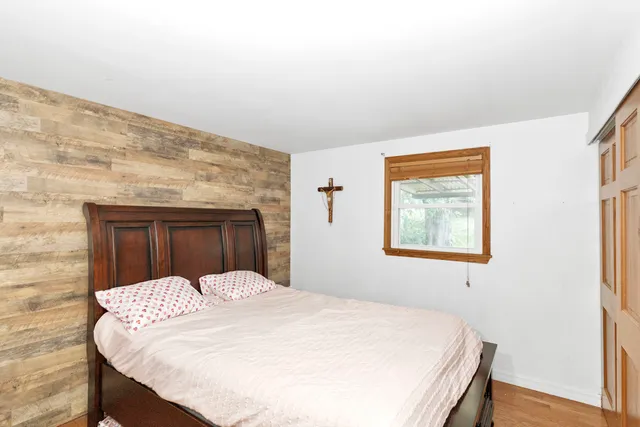 a large bed in a white room