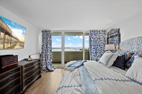 a living room with furniture a couch and a window