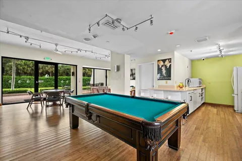 a swimming pool with yard and outdoor seating