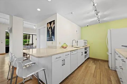 a view of and swimming pool with outdoor seating