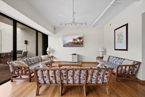 a room with furniture pool table and windows