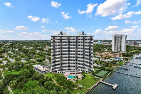 a view of a balcony with a floor to ceiling window and wooden fence