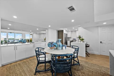 a kitchen with stainless steel appliances a refrigerator and a stove top oven