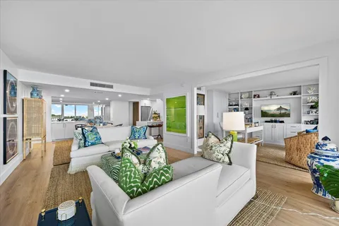 a dining room with furniture and wooden floor