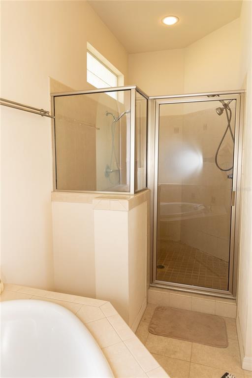 6494 Northwest 109th Place Alachua, FL 32615 - Photo 12 of 19 a bathroom with a shower and a window
