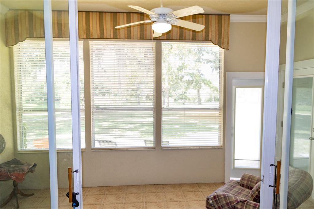 6494 Northwest 109th Place Alachua, FL 32615 - Photo 15 of 19 a living room filled with furniture and a large window