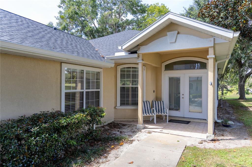 6494 Northwest 109th Place Alachua, FL 32615 - Photo 3 of 19 a front view of a house with garden