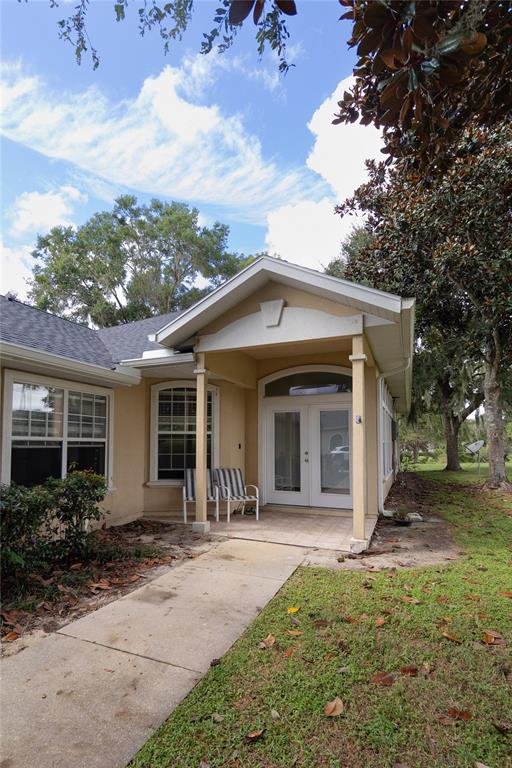 6494 Northwest 109th Place Alachua, FL 32615 - Photo 5 of 19 a front view of a house with garden