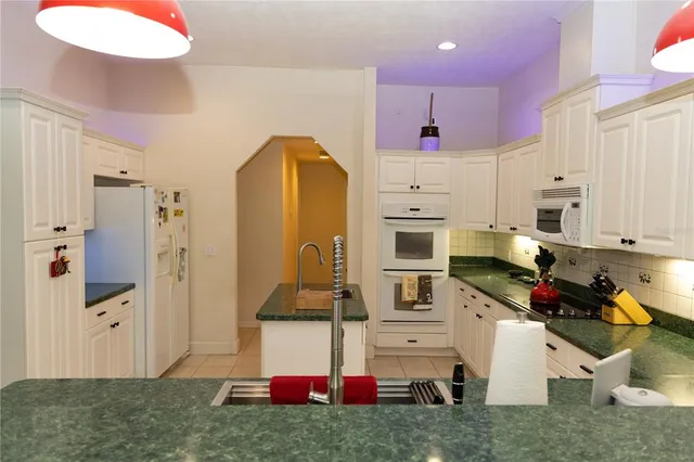 a view of kitchen center island and living room