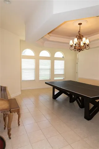 a living room with chandelier furniture and a chandelier