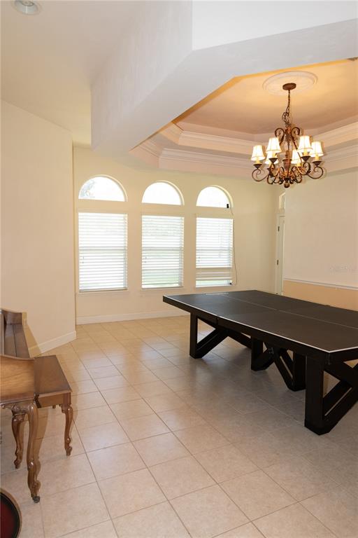 6494 Northwest 109th Place Alachua, FL 32615 - Photo 8 of 19 a living room with chandelier furniture and a chandelier