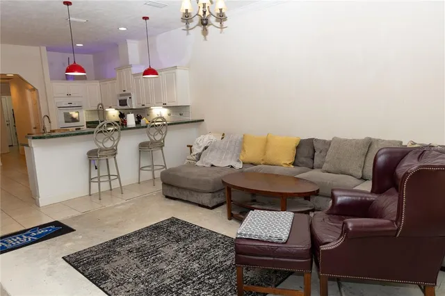 a living room with furniture and a rug