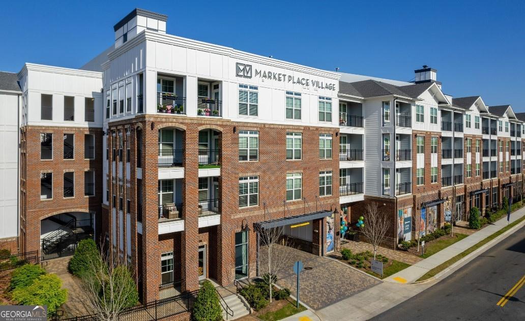 1486 Terrell Mill Road Southeast, Unit 449 Marietta, GA 30067 - Photo 17 of 25 a front view of a multi story building