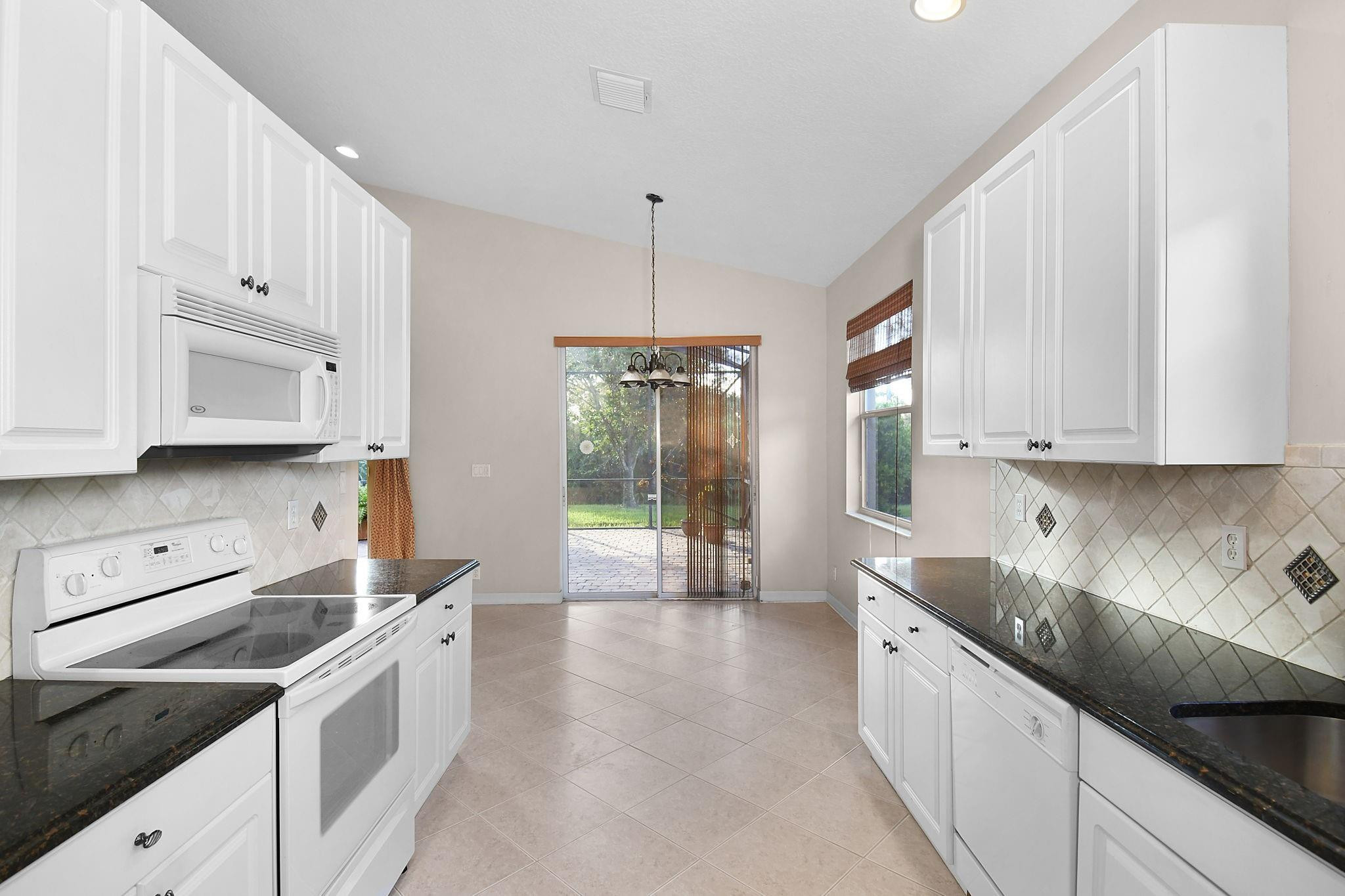 7084 Southeast Cricket Court Stuart, FL 34997 - Photo 11 of 60 DINETTE AREA WITH ACCESS TO LANAI