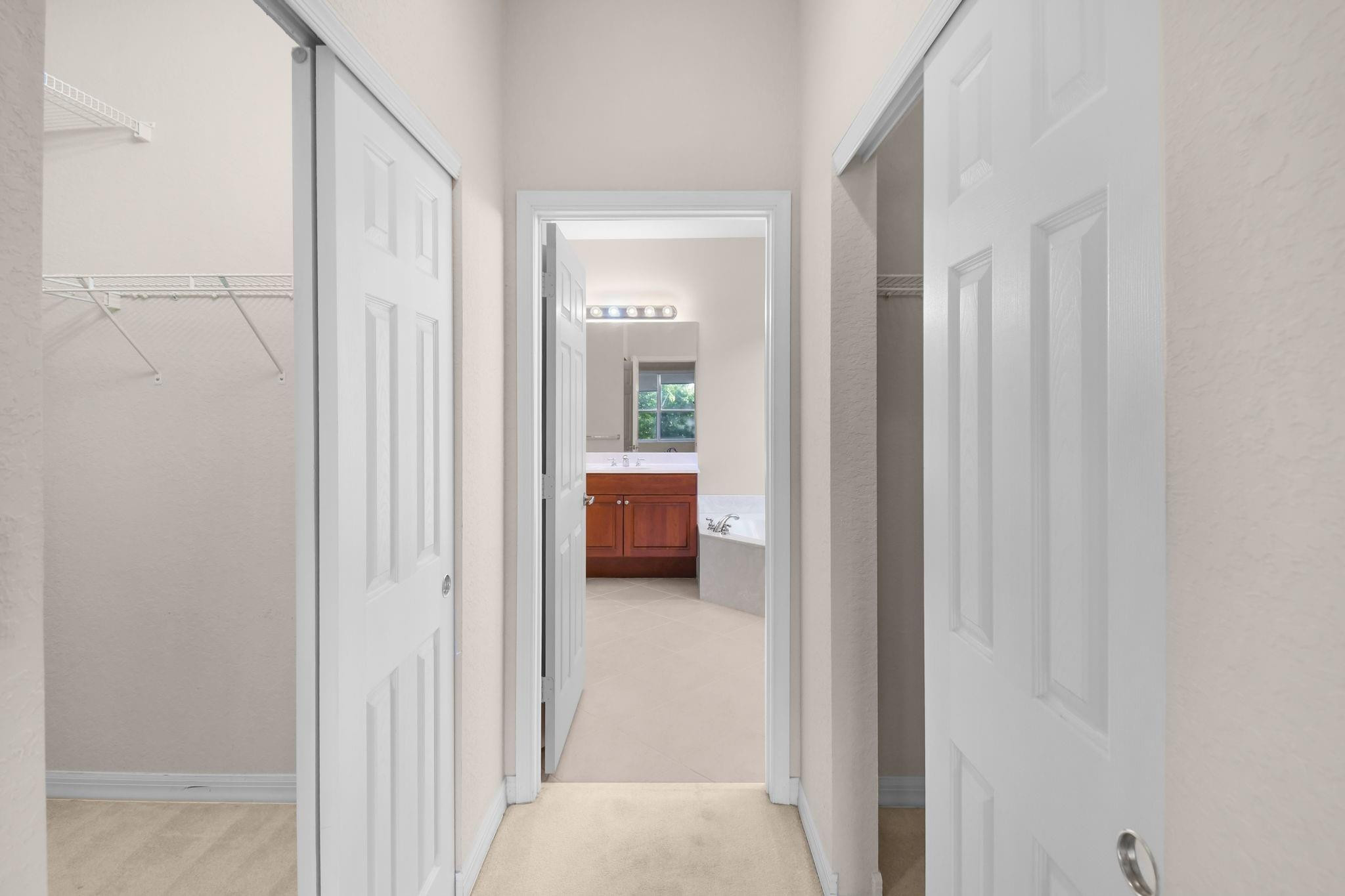 7084 Southeast Cricket Court Stuart, FL 34997 - Photo 17 of 60 2 WALK-IN CLOSETS
