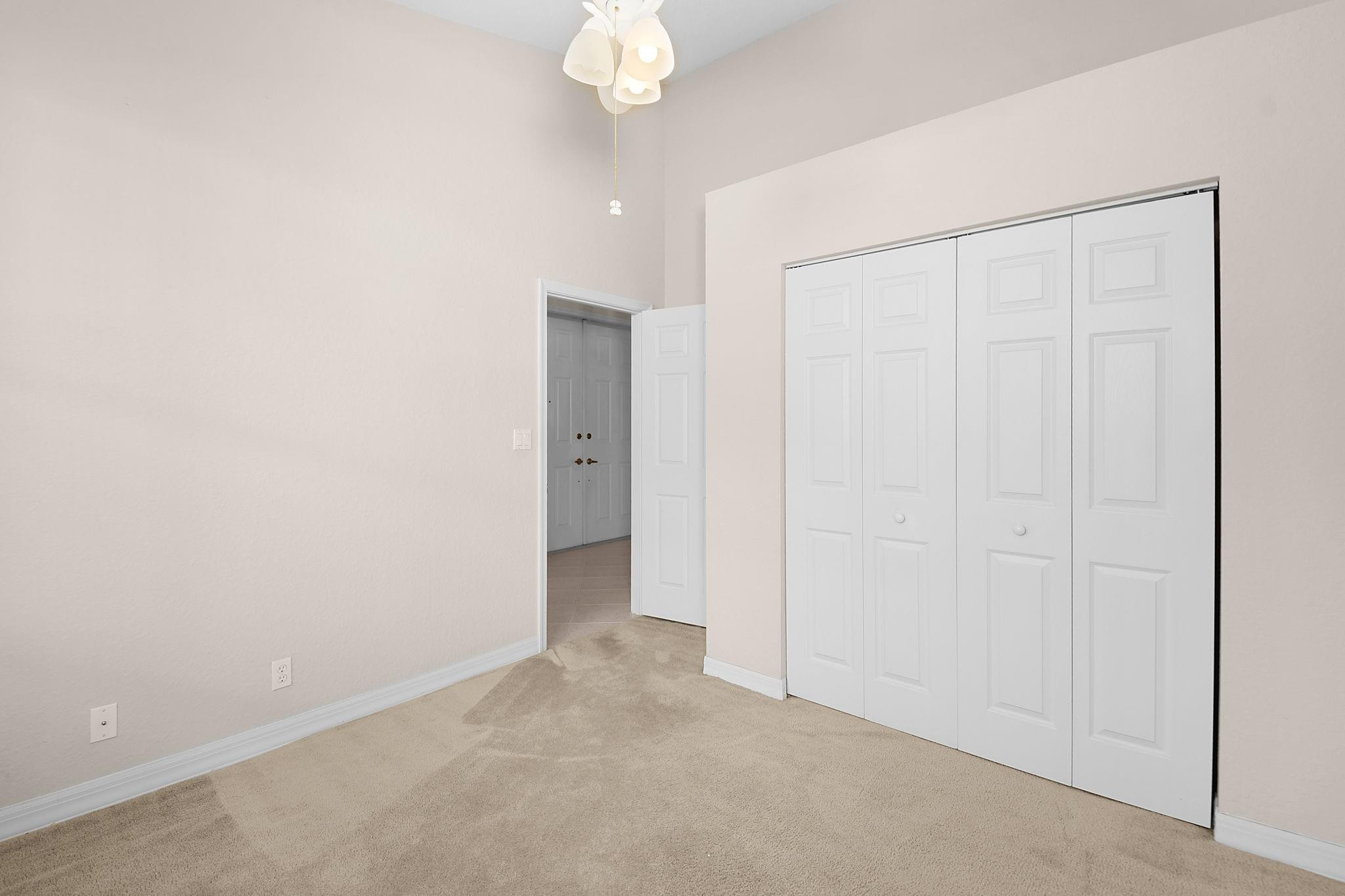 7084 Southeast Cricket Court Stuart, FL 34997 - Photo 21 of 60 MIDDLE GUEST BEDROOM