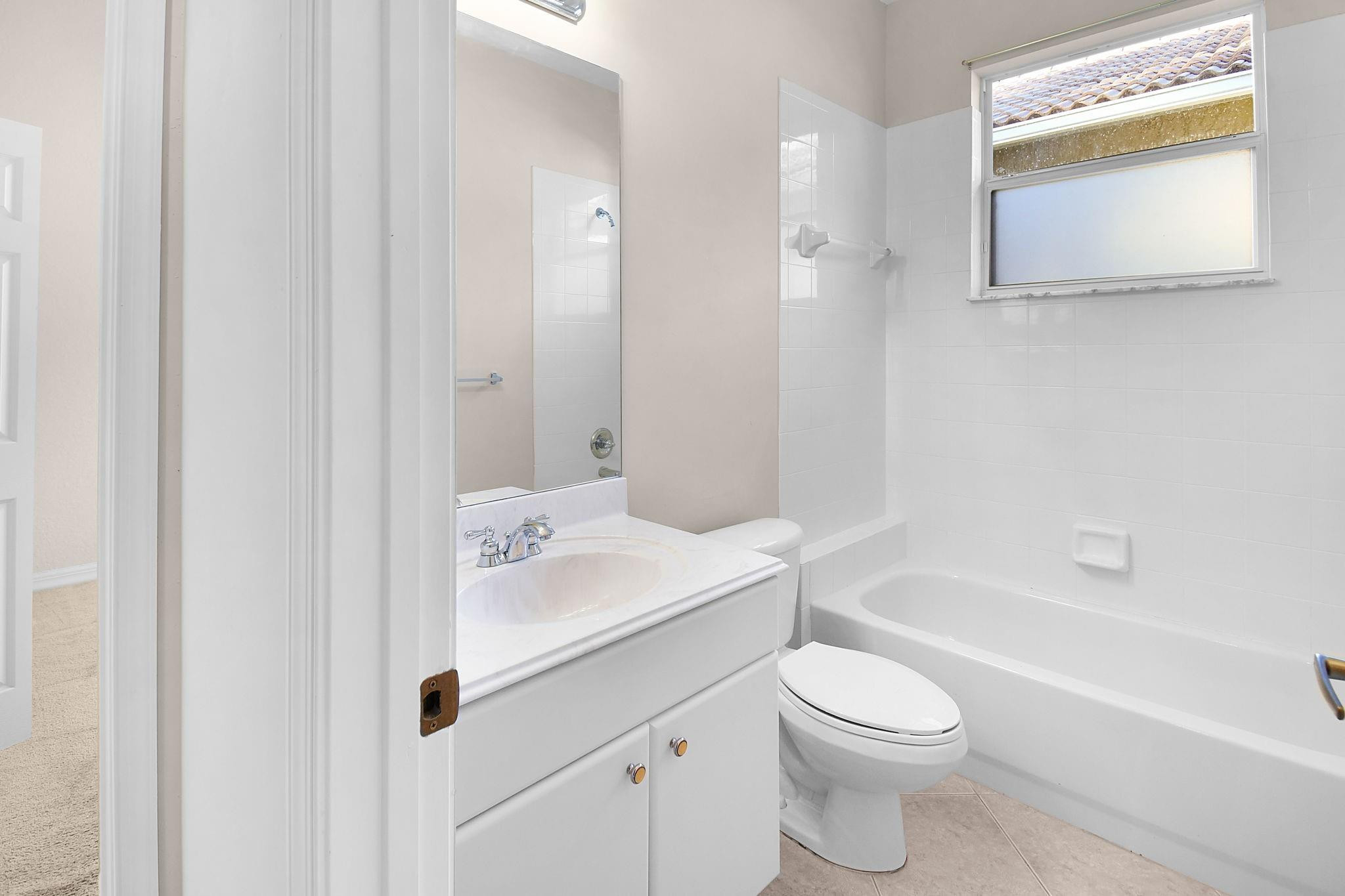 7084 Southeast Cricket Court Stuart, FL 34997 - Photo 23 of 60 GUEST BATHROOM