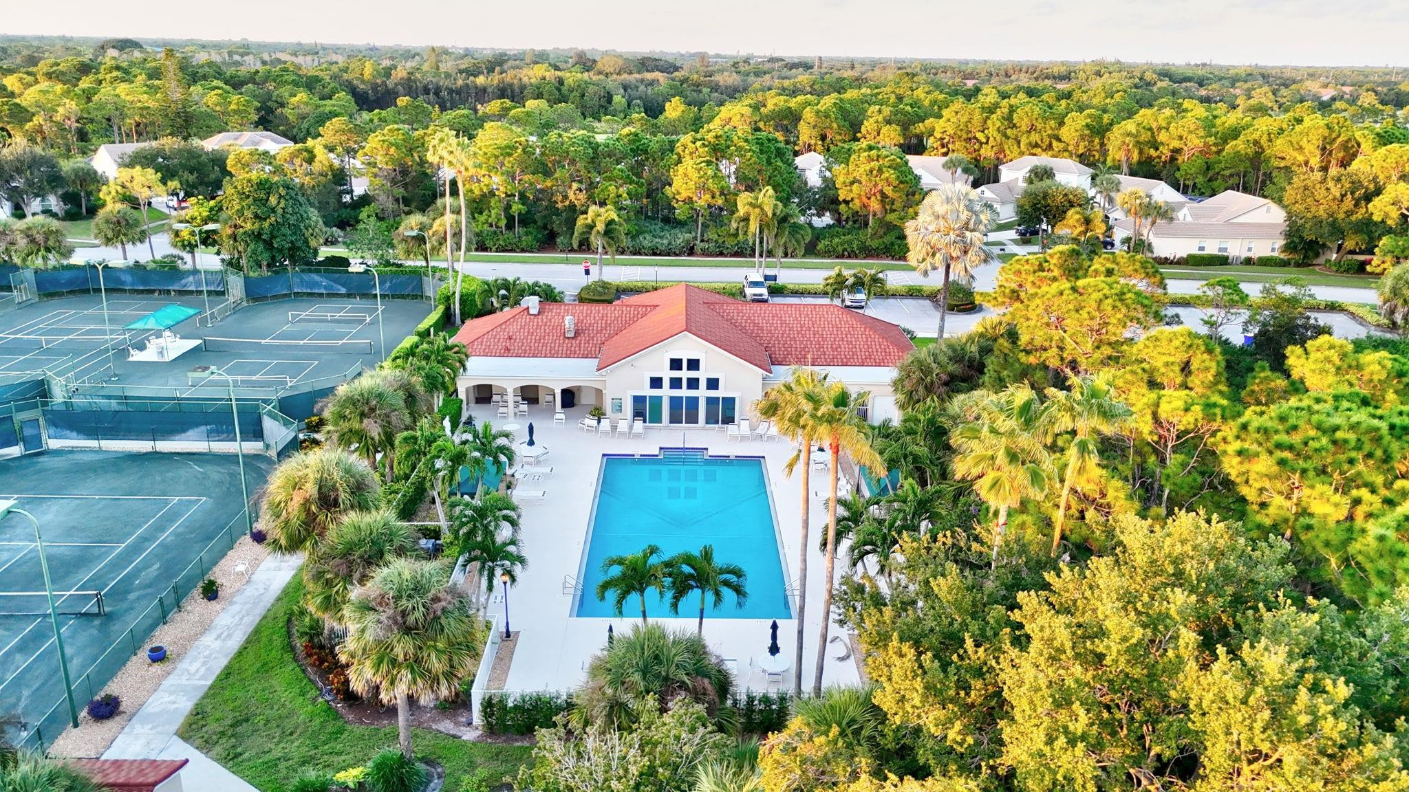 7084 Southeast Cricket Court Stuart, FL 34997 - Photo 54 of 60 AERIAL VIEW OF POOL AND COURTS