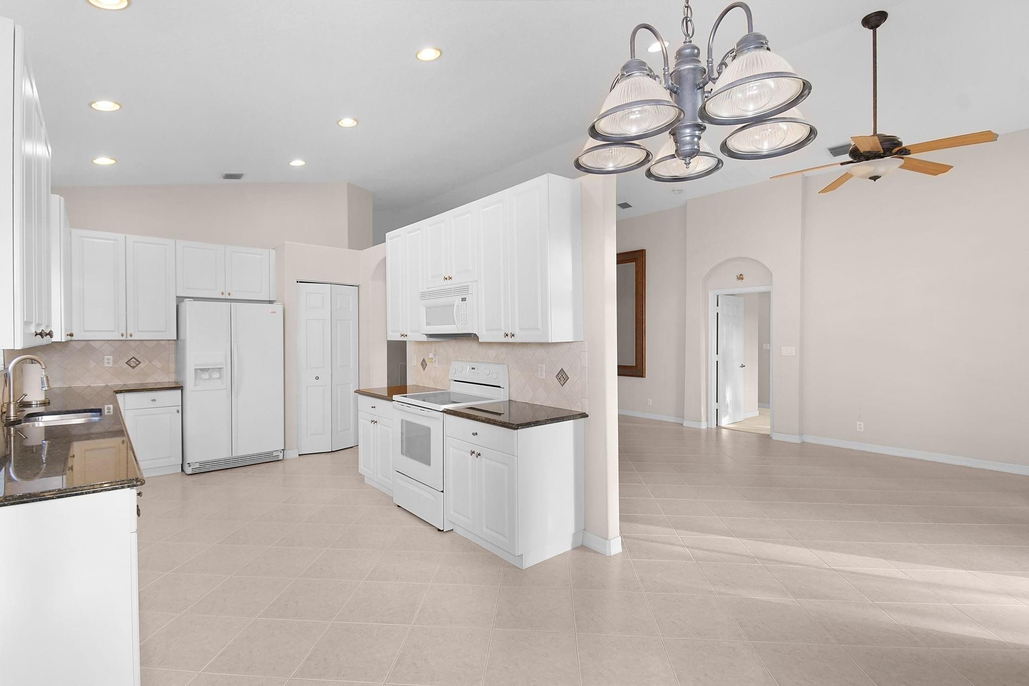 7084 Southeast Cricket Court Stuart, FL 34997 - Photo 9 of 60 LARGE FUNCTIONAL KITCHEN WITH PANTRY