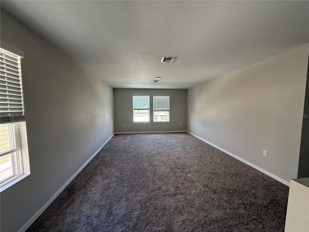 3464 Dahlia Drive Haines City, FL 33844 - Photo 19 of 41 an empty room with a window