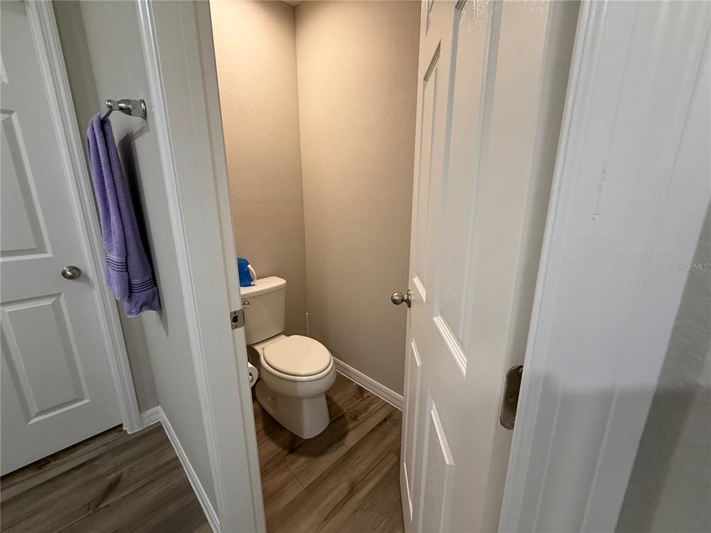 3464 Dahlia Drive Haines City, FL 33844 - Photo 23 of 41 a white toilet sitting next to a sink