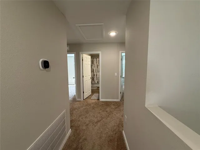 a bathroom with sink a mirror a bathtub and shower