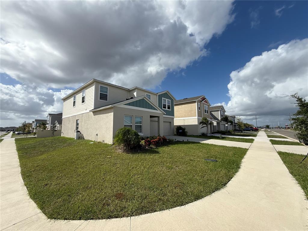 3464 Dahlia Drive Haines City, FL 33844 - Photo 3 of 41 a front view of a house with a yard