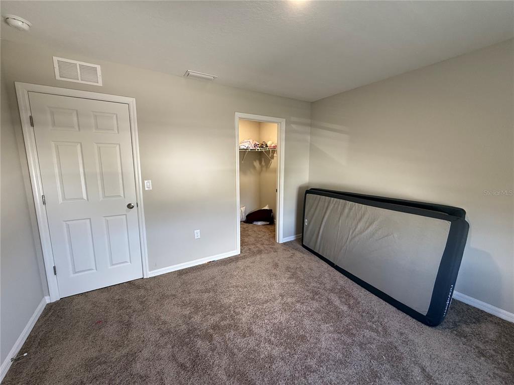 3464 Dahlia Drive Haines City, FL 33844 - Photo 32 of 41 a view of an empty room and wooden floor