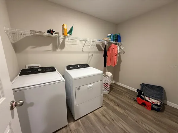 a view of dining room with furniture and wooden floor
