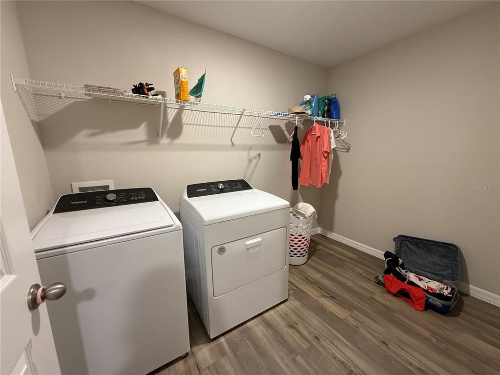 3464 Dahlia Drive Haines City, FL 33844 - Photo 34 of 41 a utility room with dryer and washer